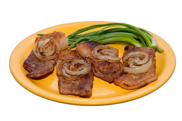 juicy steak with onions on a plate