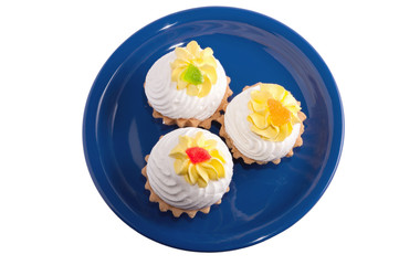blue plate with cake with cream isolation