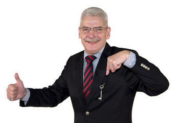 senior manager pointing at key and posing with thumbs up