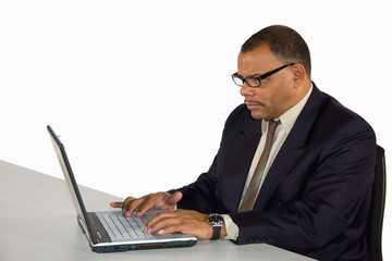 concentrated businessman working with laptop