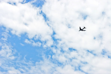 Fototapeta na wymiar airplane in bright blue sky