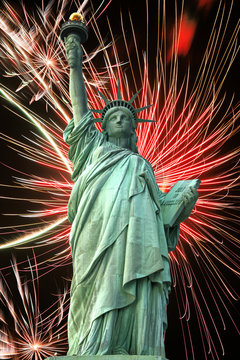 Statue Of Liberty And Fireworks In Black Sky