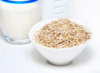 Porridge and milk on a white background
