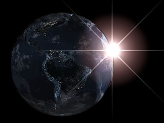 Fototapeta premium Earth planet in the night with sunrise