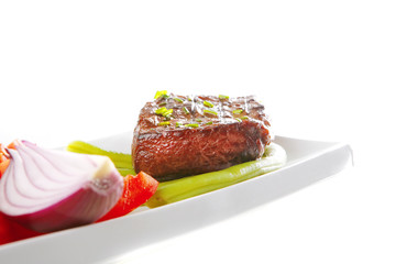 roast meat served with tomato