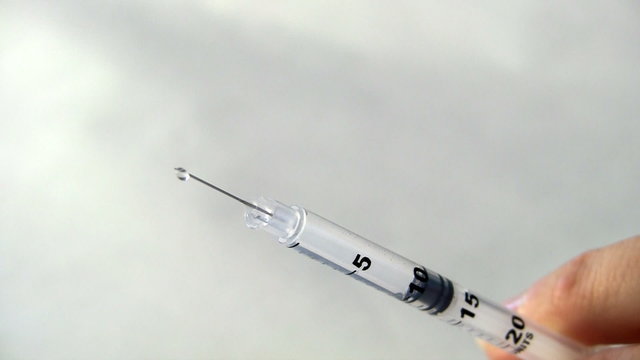 Syringe needle dripping medication