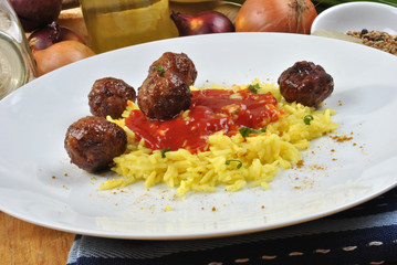 organic curry rice with meat balls on a plate