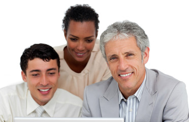 Multi-ethnic business people working at a computer