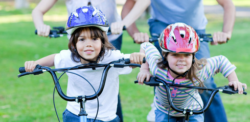 Naklejka premium Jolly children riding a bike