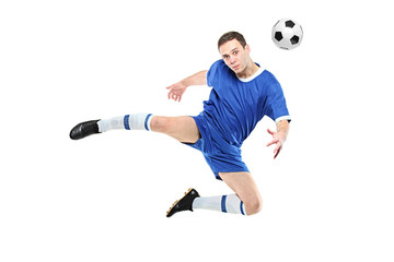 Soccer player with a ball in jump isolated on white background
