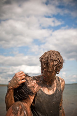 couple playing in the mud