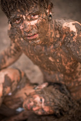 couple playing in the mud