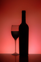Silhouette of a glass and Bottle of red wine