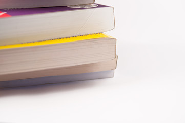 Books stacked together seen from the side