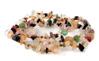 Lightweight beads from different stones on a white background