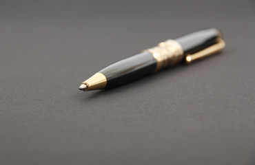 The beautiful pen on a black background
