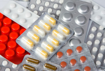 Packings of medical pills and tablets.