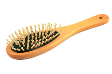 Wooden hair comb on isolated white background