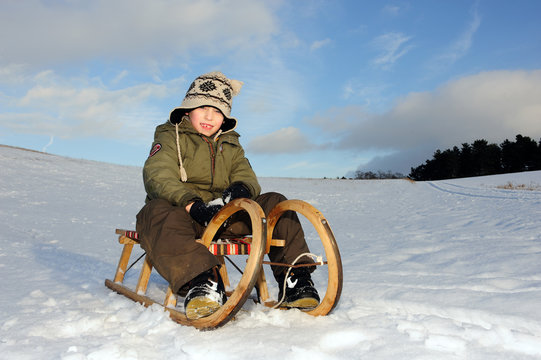 little boy with sledge
