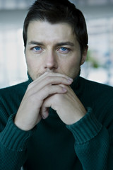 Portrait of young serious man, close-up