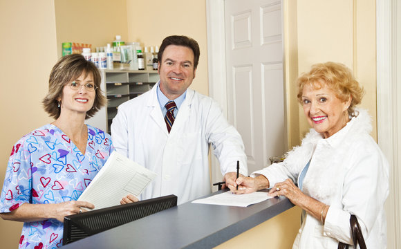 Doctor And Staff Greet Patient