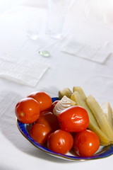 Salted tomatoes and pickled cucumbers