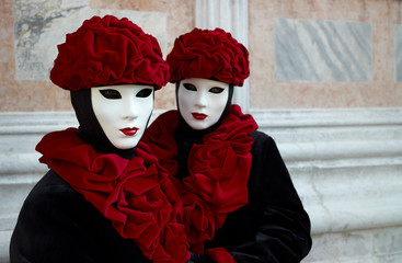 Couple of beautiful female masks in creative red and black costu