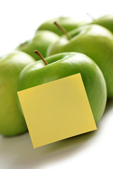 green apples and notepaper