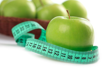 green apple and measuring tape