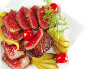 meat chunk and slices on plates