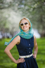 Naklejka premium Young woman at spring park