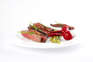 meat slices on white dish