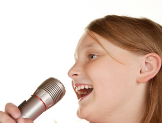 young girl singing karaoke on white