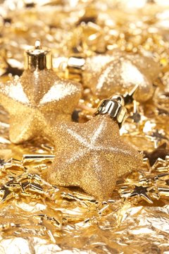 Christmas gold stars on the gold background