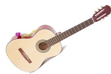 Obraz premium a yellow acoustic guitar isolated on white