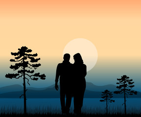 couple walking in the nature at sunset