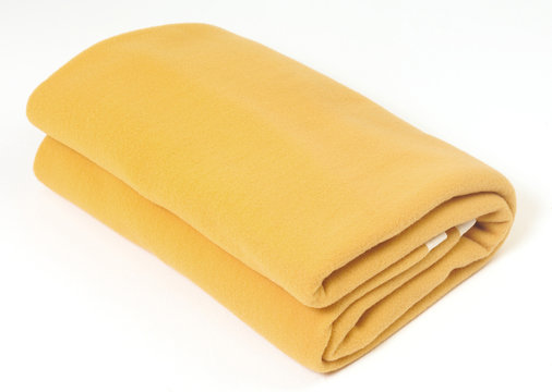 Yellow blanket against a white background