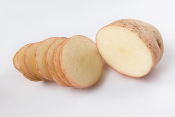 Raw sliced potatoes.Raw cut potatoes over white background
