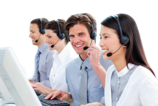 Positive business people in a call center
