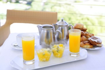 Breakfast with orange juice coffe tea milk