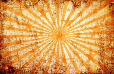 orange grunge background with sun rays and stars
