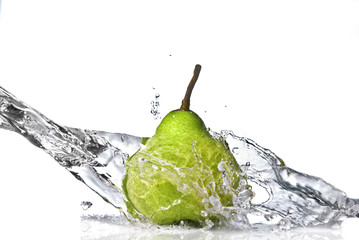 fresh water splash on green pear isolated on white