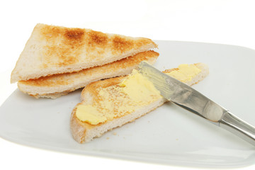 Buttering toast