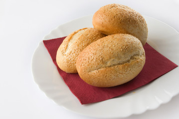 Three Bread Rolls on a red napkin