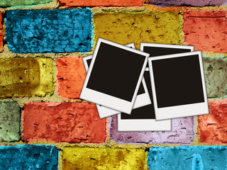 blank photos on painted brick wall