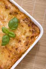 Lasagna and basil in casserole
