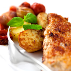 Roast pork with parmesan and baked vegetables