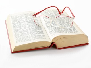 thick book and glasses