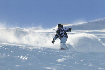Fototapeta na wymiar freestyle snowboarder jump and ride