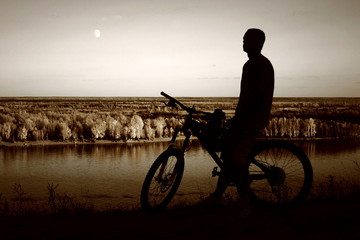 Obraz premium mountain biker silhouette